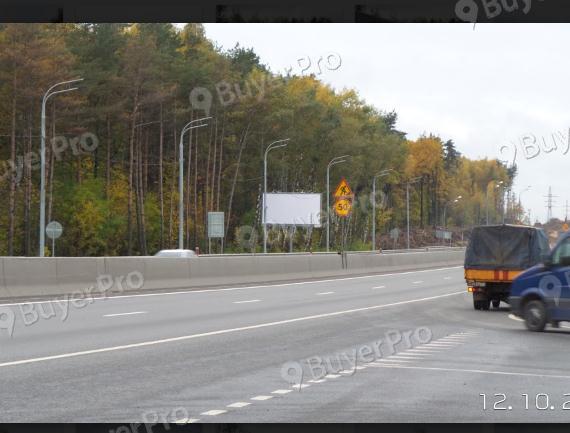 Рекламная конструкция М-1 «Беларусь», 25км+200м / перед поворот в коттеджный поселок Сапожок, левая сторона (Фото)